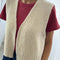 model wearing cream granny sweater vest with open front