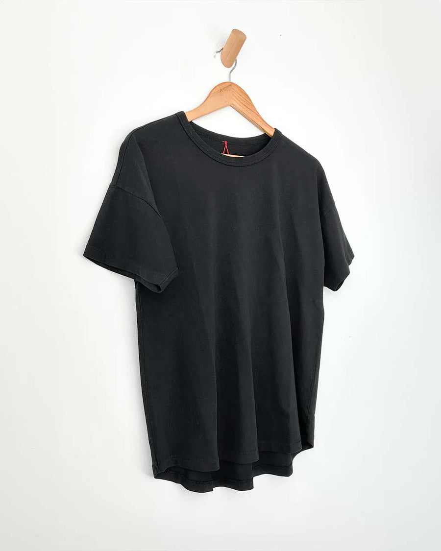 black relaxed fit tee on a hanger