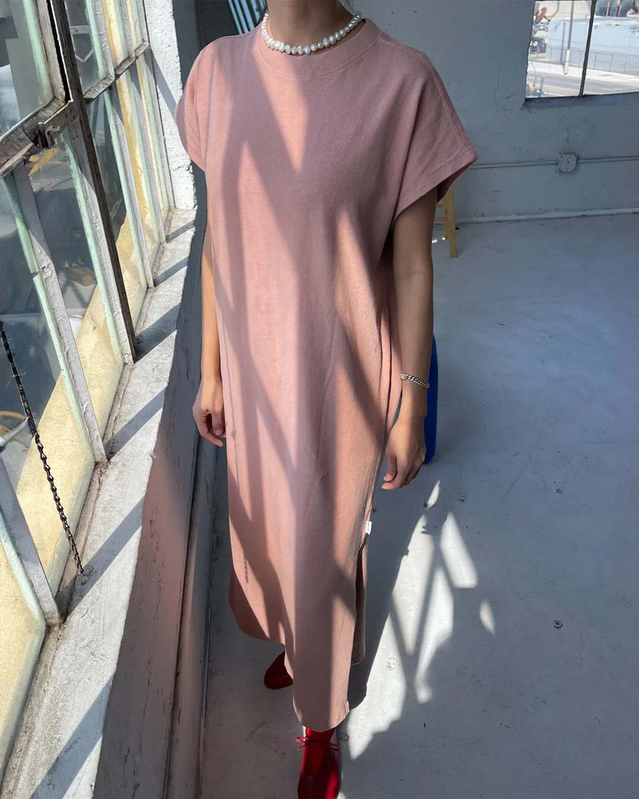 model wearing macchiato jeanne dress with cap sleeves and side slit