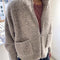 model wearing taupe grey fluffy jacket with collar, zip front and patch pockets