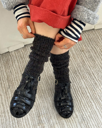 model wearing black heather slouchy socks