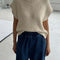 model wearing naturel short sleeve sweater top with denim