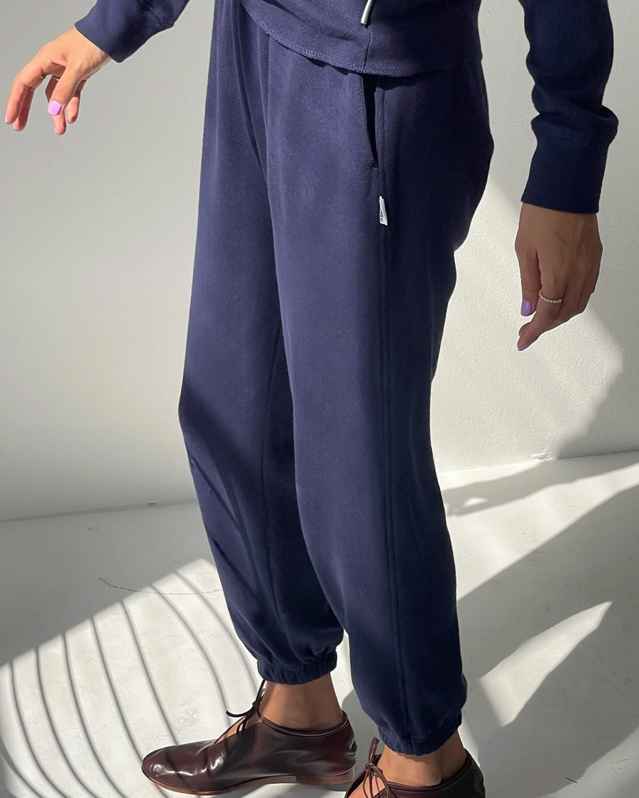 side view of model wearing navy pointelle jogger pants