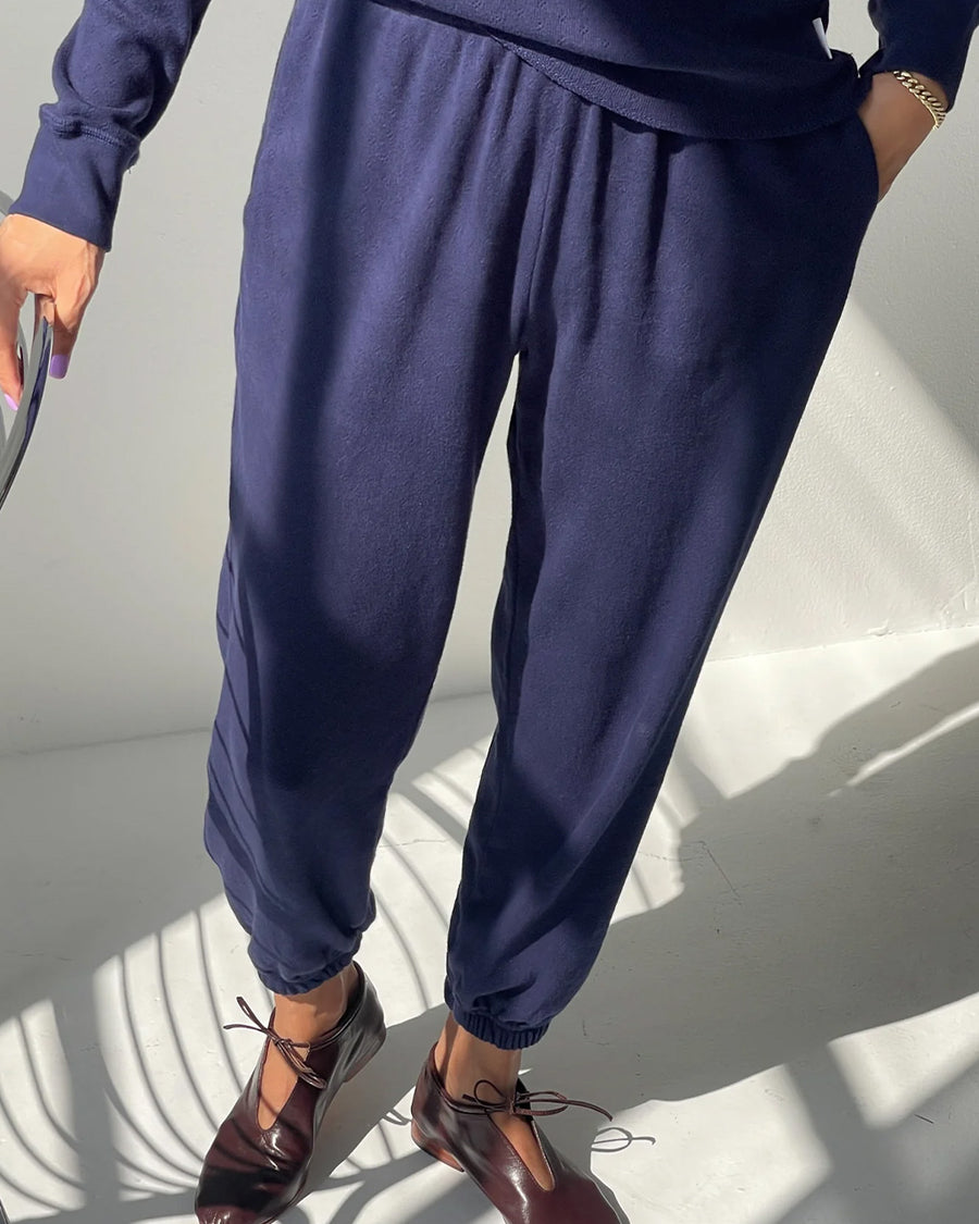 side view of model wearing navy pointelle jogger pants