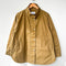relaxed fit brown/tan waxed cotton jacket with side pockets, high collar and side vents on a hanger