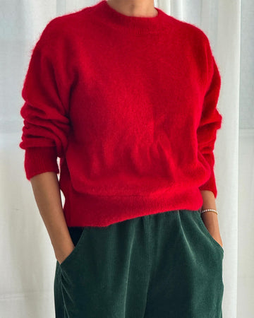 model wearing red mohair pull over sweater