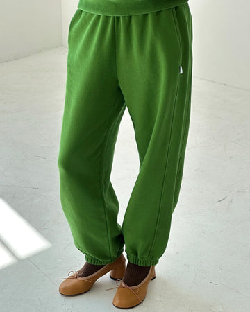 model wearing avocado french terry balloon pants with side pockets and side panels