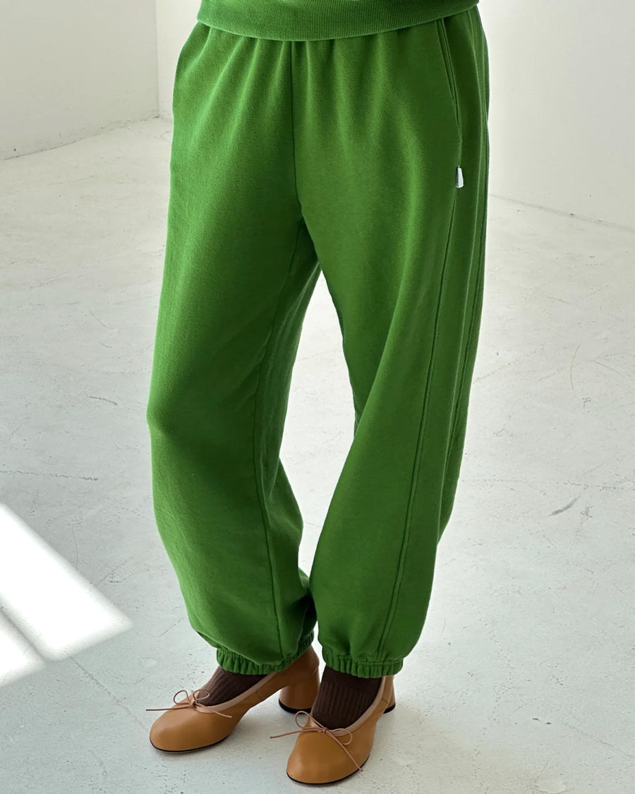 model wearing avocado french terry balloon pants with side pockets and side panels