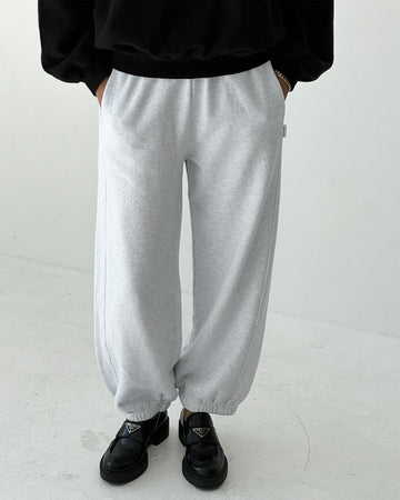 model wearing icy grey french terry balloon pants with side pockets and side panels