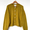 bistro yellow mohair cardigan on a hanger