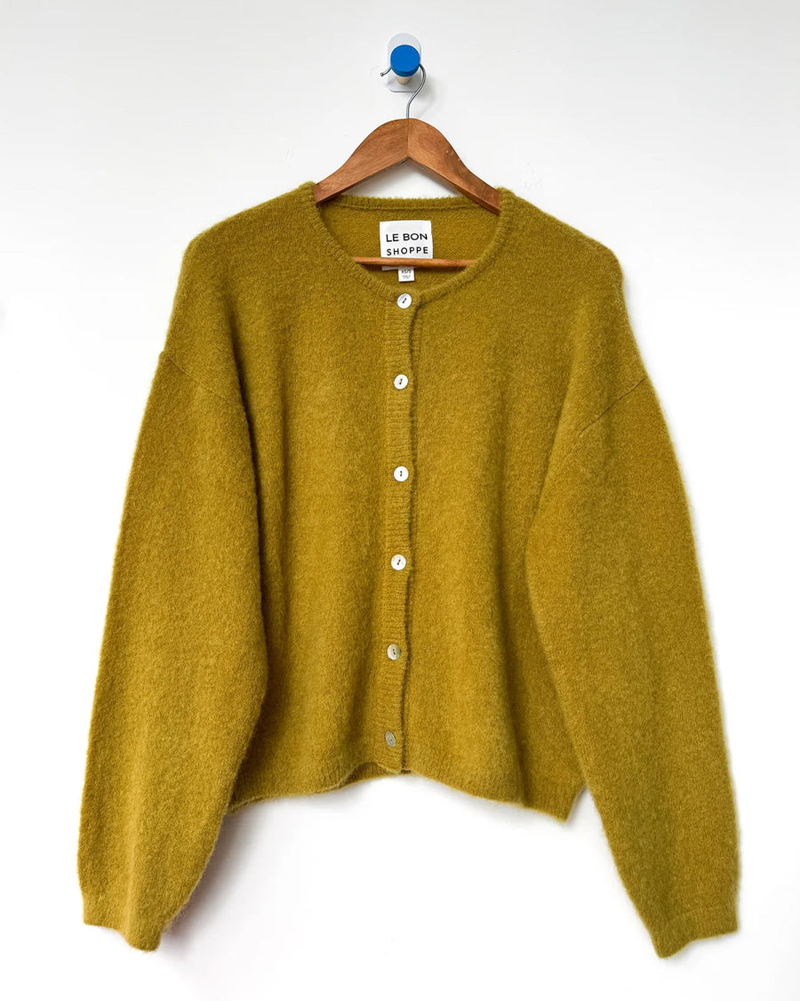 bistro yellow mohair cardigan on a hanger