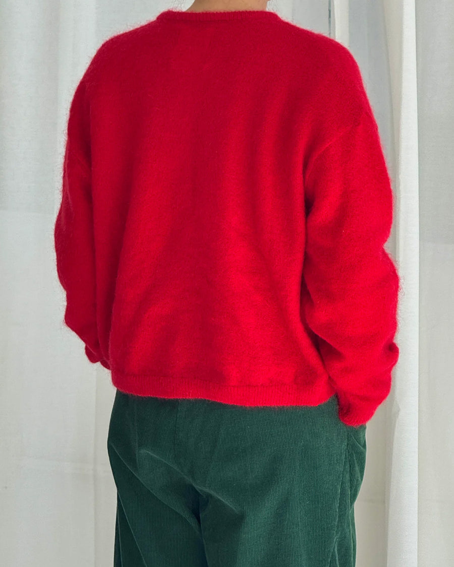 back view of model wearing red mohair cardigan