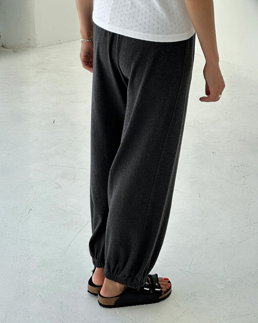 back view of model wearing charcoal pointelle cotton balloon pants