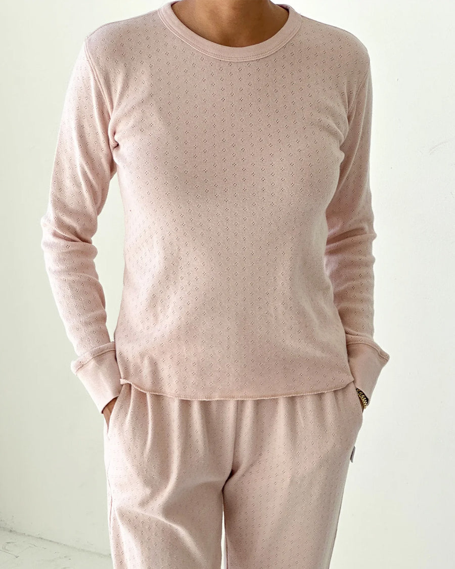 model wearing light pink pointelle long sleeve tee