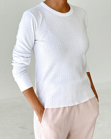 model wearing white pointelle long sleeve tee
