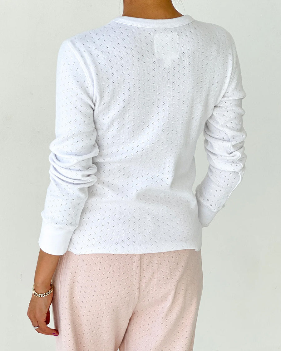 back view of model wearing white pointelle long sleeve tee