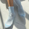 model wearing light blue socks with cushioned cuff 