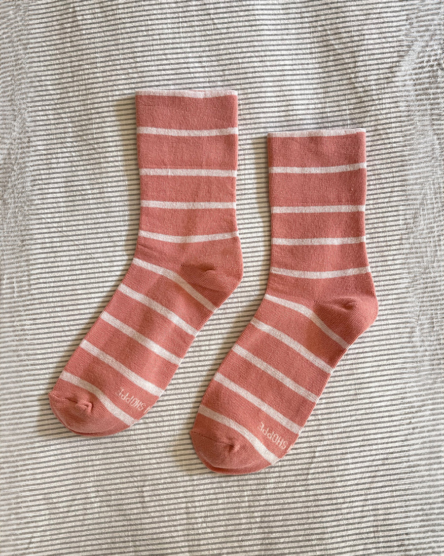 pair of high clay and white striped socks