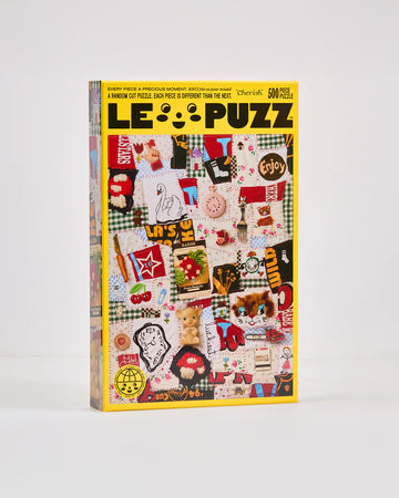 500 piece puzzle with various textiles and trinkets