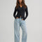 model wearing medium wash loose crop button fly jeans