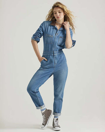 model wearing denim union-all with zipper front and brown corduroy collars