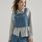model wearing denim overall bib top with adjustable straps, cropped length and front pocket