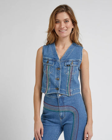 model wearing blue jean cropped vest with rainbow lines down the bust