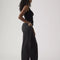 side view of model wearing low rise washed black wide leg jeans 