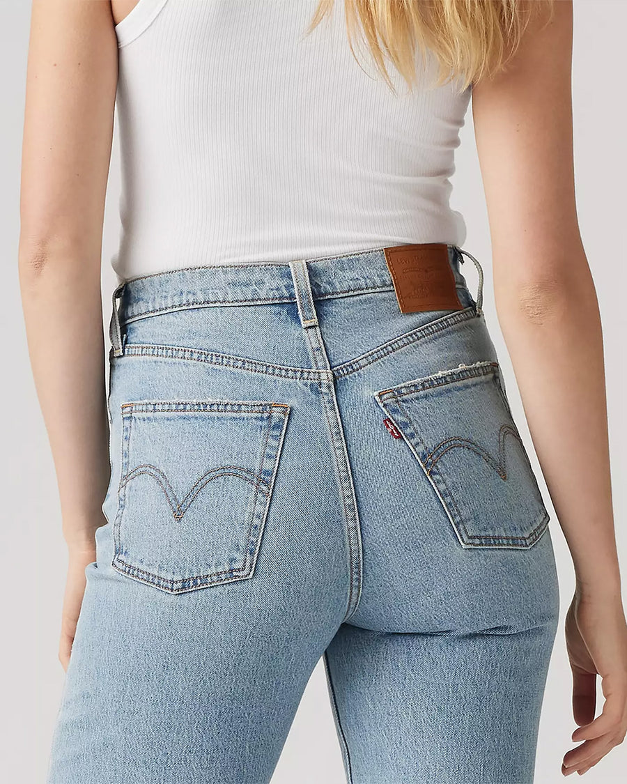up close of back of light wash ribcage straight ankle jeans