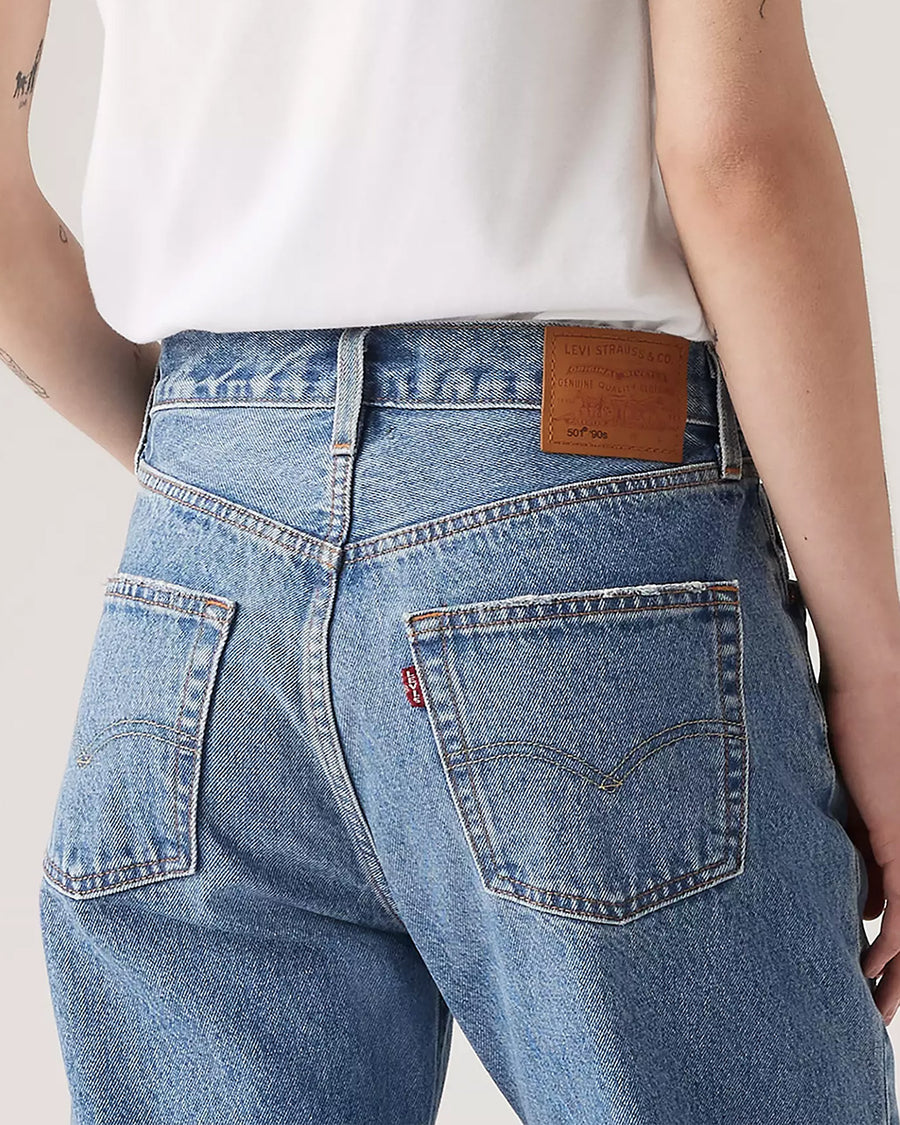 up close of back view of model wearing light denim 90's ankle jeans