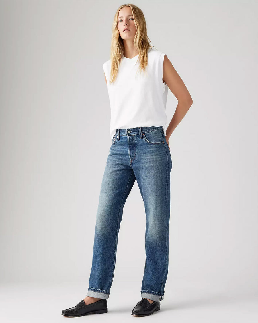 model wearing medium wash 90's selvedge jeans