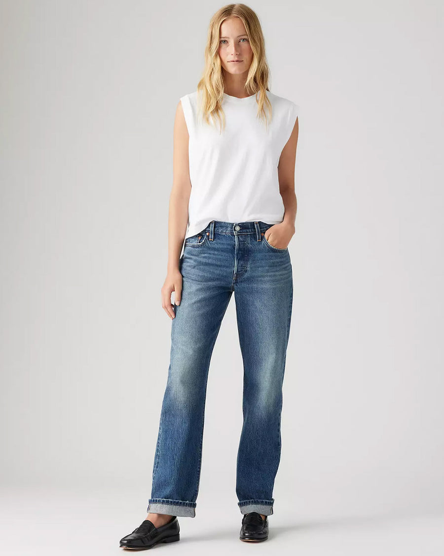 model wearing medium wash 90's selvedge jeans