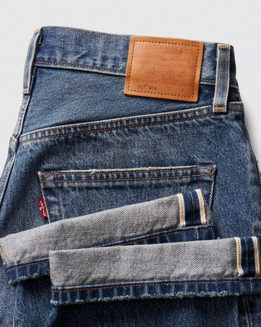 up close of folded medium wash 90's selvedge jeans