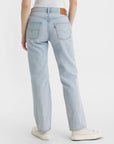 backview of model wearing light and medium color patchwork denim jeans