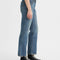 sideview of model wearing relaxed medium denim jeans