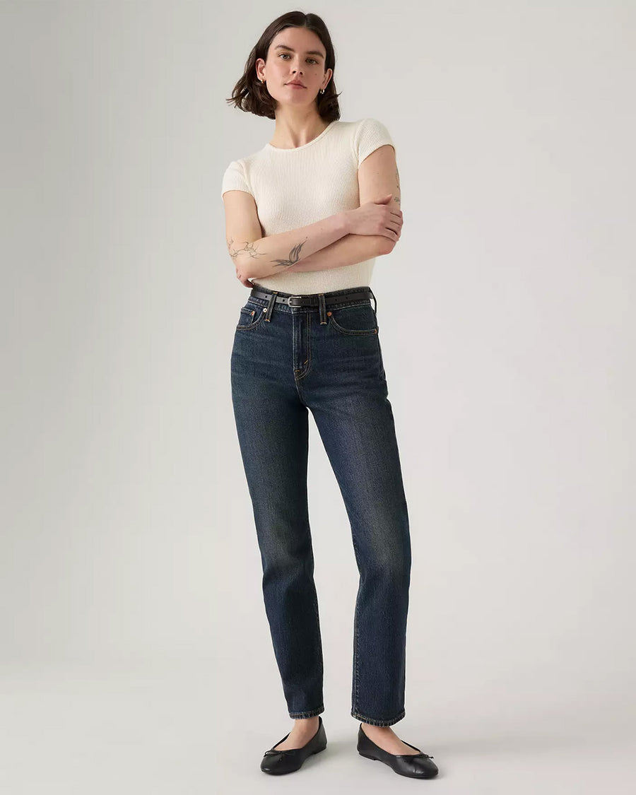 model wearing dark denim wedgie slim fit jeans