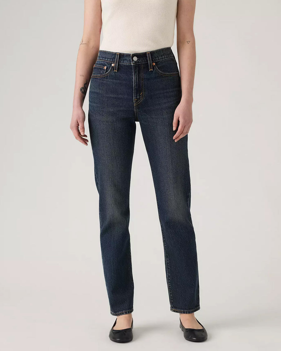 bottom view of model wearing dark denim wedgie slim fit jeans