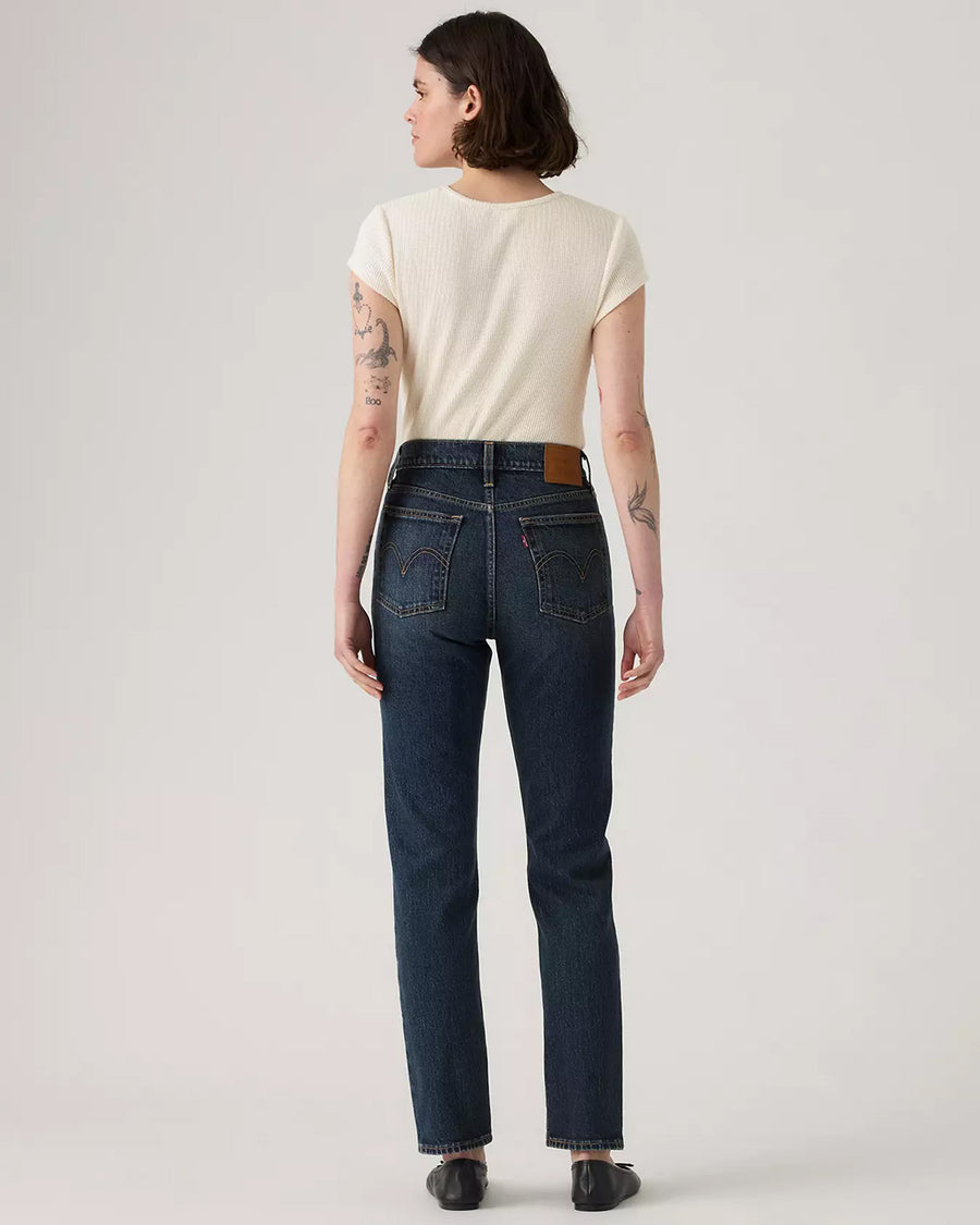 back view of model wearing dark denim wedgie slim fit jeans