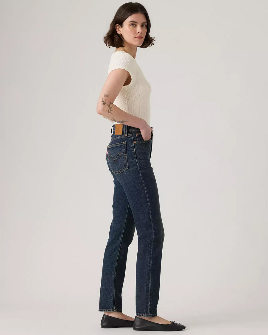 side view of model wearing dark denim wedgie slim fit jeans