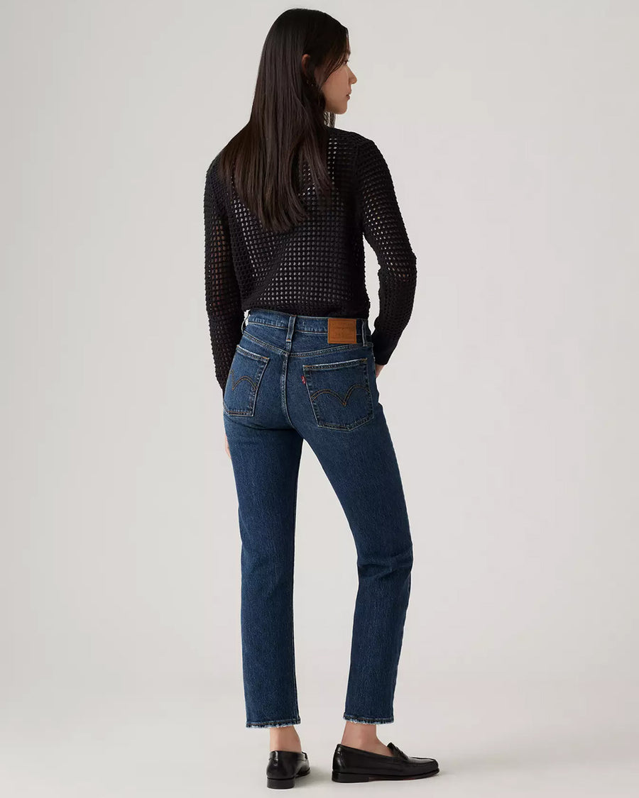 back view of model wearing dark wash wedgie straight jeans