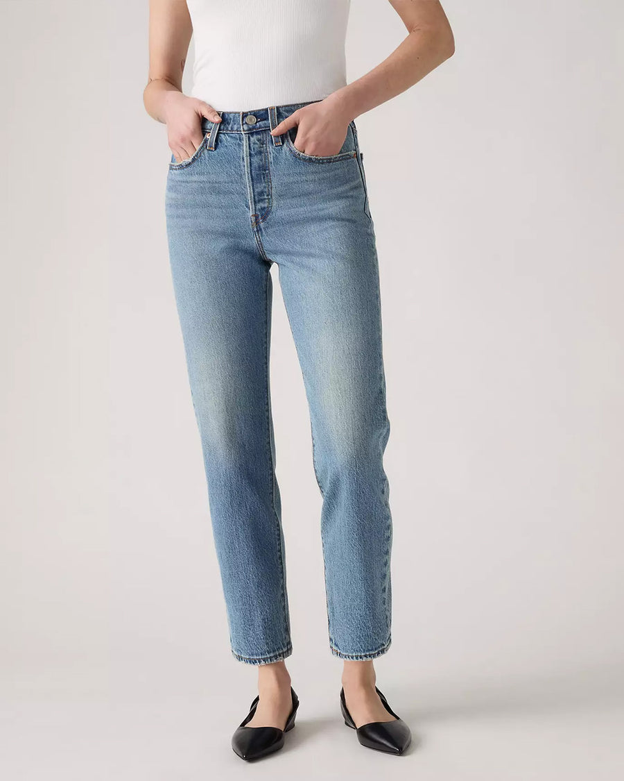 bottom view of model wearing light denim wedgie straight jeans