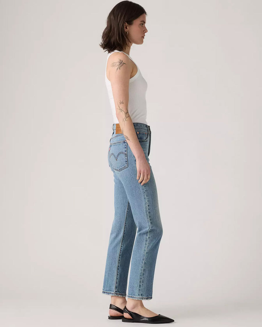 side view of model wearing light denim wedgie straight jeans