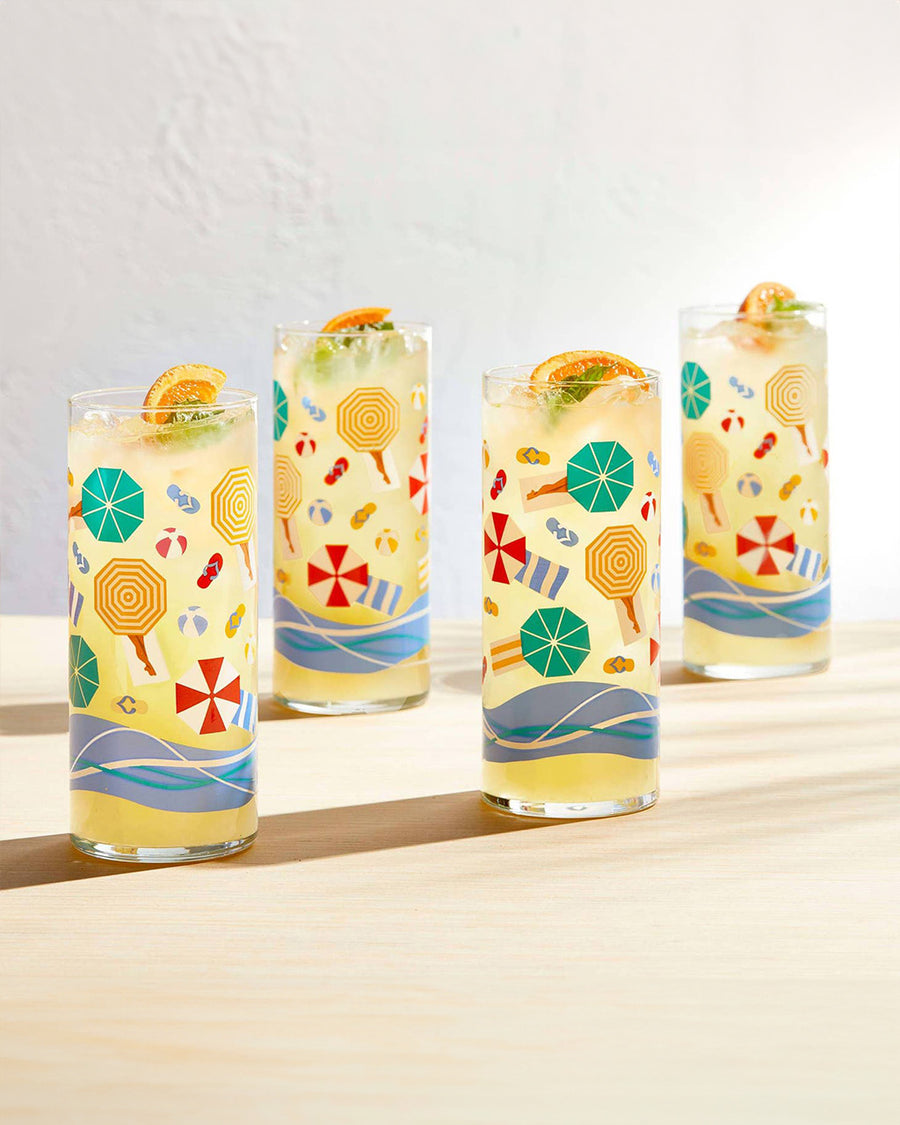 set of 4 glasses with vintage beach scene