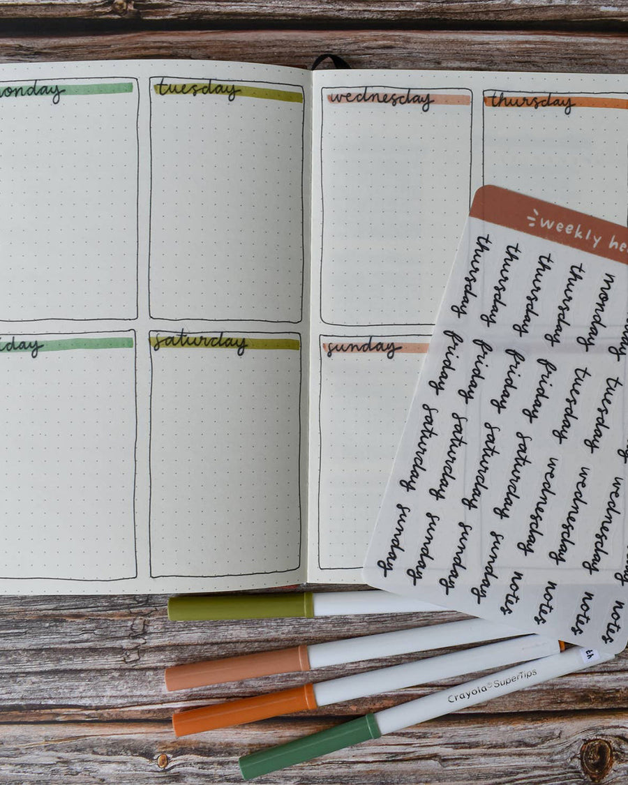 notebook with day/week sticker headers