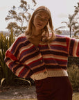 model wearing colorful horizontal stripe cardigan