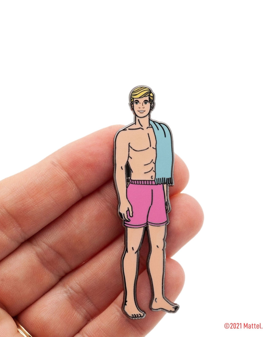 model holding malibu beach ken with pink swim trunks