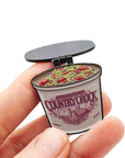 opened country crock pin with hinged lid and spaghetti and meatballs inside