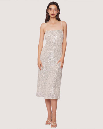 model wearing thin strap silver sequin midi dress with back cutout