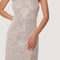 up close of model wearing thin strap silver sequin midi dress with back cutout