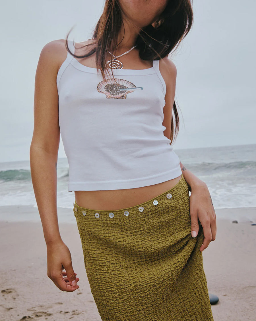 up close of model wearing olive crinkle midi skirt with shaped shell buttons on the top 